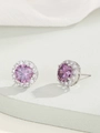 Macro shot of halo stud earrings with round purple zircon and shimmering white micro-pave - Silver Tone Purple Zirconia