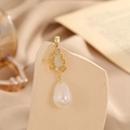 Detailed view of a gold butterfly pendant featuring a water-drop pearl and zirconia accents - Gold Butterfly Teardrop Artificial Pearl