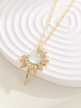 Detail of sunburst pendant with turquoise beads and micro-pave crystals on gold necklace - Gold