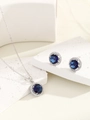 Detail of blue sapphire zircon pendant necklace and stud earrings set on marble stone - Silver Royal Blue