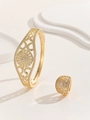 Detail of gold hollow floral bracelet and ring set with micro-inlaid zircons - Hollow Sunflower Style (TT-00496-01) / Gold / Size 7