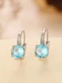 Detailed view of silver stud earrings with large round blue gems and zircon accents - Round (TE-09701-06)