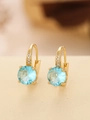 Macro shot of gold hoop earrings featuring large round blue gemstones and small zircon accents - Round (TE-09701-03)