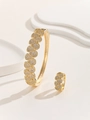 Detailed macro shot of gold-plated bangle and ring set with micro-pave cubic zirconia - Gold / Size 7