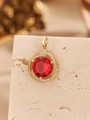 Golden halo pendant featuring a large red round gemstone with brilliant white zircon accents - Pendant Only (Without Chain) / Gold Magenta