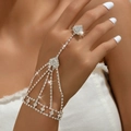 Sparkling silver hand chain ring with rhinestones for elegant evening and party wear - Radial Rhinestone Style (990) / Silver