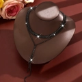 Elegant multi-layered black rhinestone tassel necklace with shimmering crystal fringe - Black