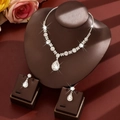 Detail of bridal jewelry set with pear-shaped rhinestones on professional display stand - Two-Piece Set / White
