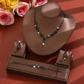 Detail shot of black crystal jewelry set with water drop pendants on leather display - Three-Piece Set / All Black