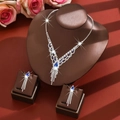 Luxury blue teardrop crystal necklace and earrings set with elegant silver tassels - Two-Piece Set / Blue