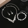 Elegant silver-toned bridal jewelry set with pearls and rhinestones on a black surface - HB771747 Set / Silver
