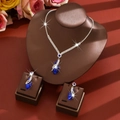 Elegant silver jewelry set with dark blue heart pendant necklace and matching drop earrings - Two-Piece Set / Blue