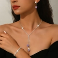 Macro shot of purple heart-shaped crystal jewelry set with sparkling tassels and zircon - 3-Piece Set (HB1748) / Purple