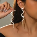 Elegant snake-shaped silver dangle earrings with sparkling rhinestones and long fringe - Gold