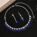 Elegant waterdrop tassel jewelry set with blue pear gemstones on black mirror background - HB1798 Necklace And Earrings / Blue
