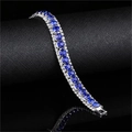 Three-row silver tennis bracelet featuring royal blue zircons and clear side stones - Blue
