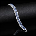 Elegant bridal bracelet with deep blue center stones and silver-tone triple-row zircon pavé - Light Blue