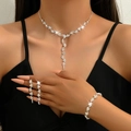 Elegant silver tassel jewelry set with shimmering rhinestones worn by a model - Rhinestone Necklace Earrings Bracelet 3-Piece Set (752747) / Silver