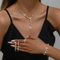 Detail view of a luxury gold bridal jewelry set with sparkling tassel necklace on model - Rhinestone Necklace Bracelet Ring Earrings 4-Piece Set (752747) / Gold