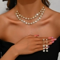 Detailed close-up of double-layer sunflower diamond necklace and earrings on model - Necklace Earrings Set (484) / Gold
