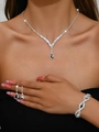 Detail of silver jewelry set with black teardrop stones and sparkling white rhinestones - Necklace Earrings Bracelet / Silver Black Stone