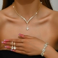 Elegant gold rhinestone jewelry set with V-shaped necklace, teardrop earrings and bracelet - Necklace Earrings Bracelet / Gold