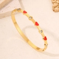 Bracelet en acier inoxydable doré avec cœurs en émail rouge et strass étincelants - Or Rouge