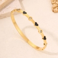 Bracelet en acier doré avec cœurs noirs émaillés et incrustations de zircons brillants - Or Noir