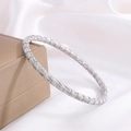Silver-toned stainless steel bracelet featuring intricate woven texture on a gift box - Silver Scratched Cylinder Bamboo Style