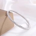Polished silver stainless steel bead bracelet with textured bamboo finish on white silk - Silver Scratched Cylinder Water Drop Style