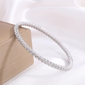 Polished silver stainless steel bead bracelet with textured spiral finish on jewelry box - Silver Scratched Bamboo Drop Style