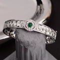 Elegant silver woven bracelet with a green gemstone and sparkling zircon accents - Green Gemstone Woven Bangle (SL0404)