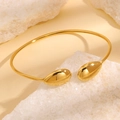 Bracelet jonc ouvert en acier inoxydable doré avec des embouts en forme de goutte - Bracelet jonc goutte lisse dorée