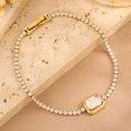 Bracelet élégant en titane doré avec cristaux taille émeraude et fermoir déployant - Style Sucre en Cube Entièrement Serti de Diamants / Or