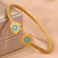 Bracelet torsadé en acier doré avec détails en émail bleu et motif soleil doré - Style Rond Octogramme Bleu