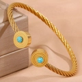 Bracelet torsadé doré avec pierres turquoise et embouts ronds gravés vintage - Style Rond Turquoise Bleu Clair