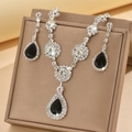 Close-up of geometric jewelry set with black pear-shaped stones and pavé cubic zirconia - Silver Tone Black (1454 Silver Black)