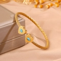 Gold-plated stainless steel cable bracelet featuring double heart-shaped blue stones - Heart Wave Light Blue Turquoise (SZ841-1-1)