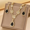 Detailed close-up of zircon necklace set with pear-cut black gems and gold finish - Gold Tone Black (1454 Gold Black)