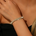Elegant gold multi-row rhinestone bracelet with twisted claw chain design for women - Gold