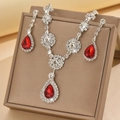 Detailed view of silver necklace and earrings set with red pear-cut zircon crystals - Silver Tone Red (1454 Silver Red)