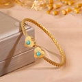 Adjustable golden twisted wire bracelet featuring heart charms with inlaid turquoise stones - Heart Blue Turquoise (SZ843-1-1)