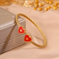 Gold cable wire heart bangle featuring red heart charms and star patterns on a display box - Red Heart Star (SZ844-1-1)