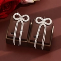 Sparkling silver bow knot long tassel earrings with pavé rhinestones for women - Silver