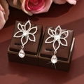 Elegant silver flower drop earrings with clear rhinestones and pear-shaped crystals - Silver