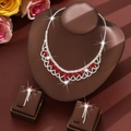 Detail of luxury bridal jewelry set with red marquise stones and silver tassels - Red