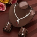 Detailed macro of bridal jewelry set with red marquise gems and sparkling rhinestones - Red Necklace Earrings Set