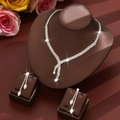 Elegant silver jewelry set with sparkling zircons and tassels for bridal or evening events - White Necklace Earrings Set