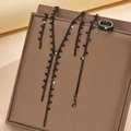 Detail of luxury jewelry set featuring black rhinestone long fringe necklace and earrings - Black Necklace Earrings Ring Set