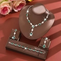 Detailed set of silver bridal jewelry with dark green teardrop crystals and pavé diamonds - Necklace, Earrings & Bracelet Set (1662+796) / Green